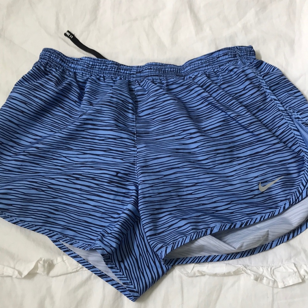 Blue Nike running shorts
